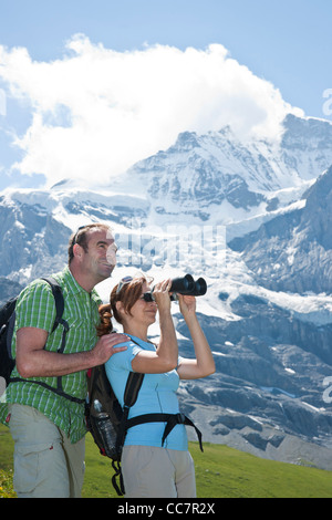 Couple Looking at View, Bernese Oberland, Switzerland Stock Photo