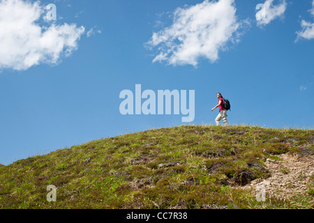 Woman Hiking on Mountain Top, Bernese Oberland, Switzerland Stock Photo