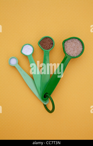 Measuring spoons full of spices Stock Photo