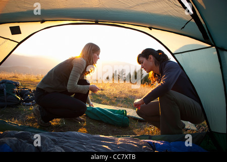 Women setting up Camp near Mt Hood, Oregon, USA Stock Photo