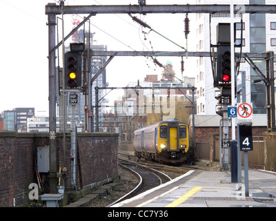 A train approaching Manchester Piccadilly Station from Manchester Oxford Road Stock Photo