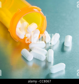 Pills Spilling from Bottle Stock Photo