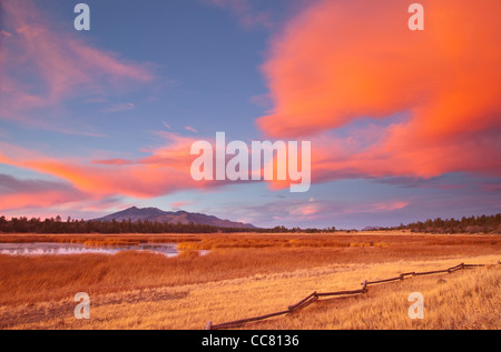 Fiery winter sunset at Marshall Lake with San Francisco Peaks in background, Coconino National Forest, near Flagstaff, Arizona Stock Photo