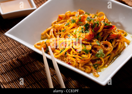 Chinese noodles with shrimps on a bamboo table Stock Photo
