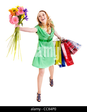 Young woman with shopping bag and flowers. Stock Photo