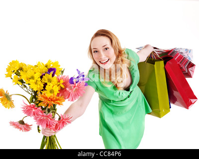 Young woman with shopping bag and flowers. Stock Photo