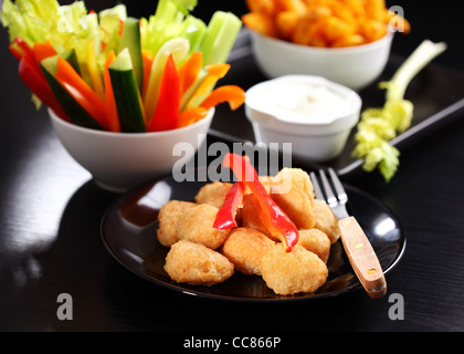 Chili cheese nuggets with raw vegetable and dip Stock Photo