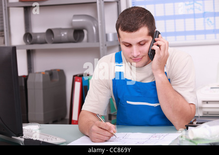 Craftsman in office  on phone Stock Photo