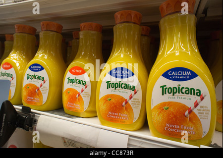 Bottles of Tropicana orange juice are seen in a supermarket refrigerator case in New York Stock Photo
