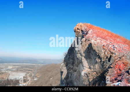 cliff top overlooking the valley on a beautiful winter day Stock Photo