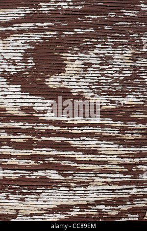 vertical old flaking brown painted plywood background Stock Photo