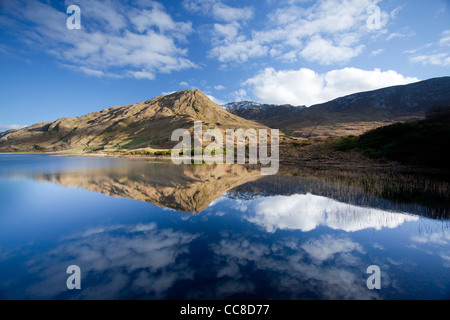 Reflection of Benbaun Mountain in Kylemore Lough, Connemara, County Galway, Ireland. Stock Photo