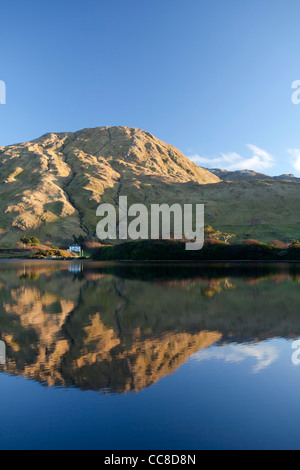 Evening reflection of the Twelve Bens Mountains in Kylemore Lough, Connemara, County Galway, Ireland. Stock Photo