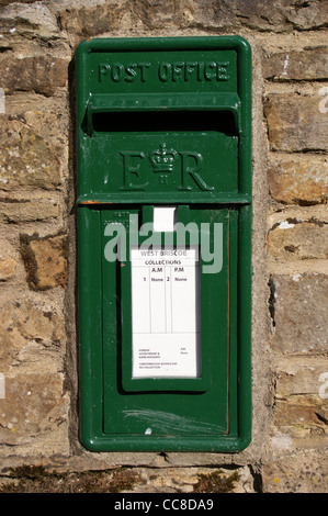 A disused green letterbox on a farm wall, Baldersdale, County Durham, England Stock Photo