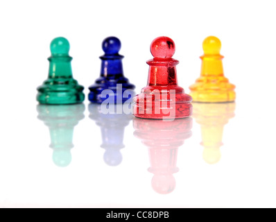 Multicolored ludo glass figures over white background Stock Photo