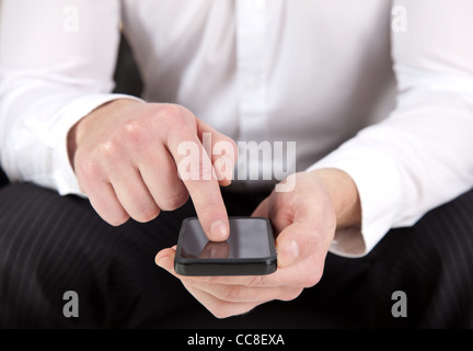 Hands of a business man using a smartphone Stock Photo