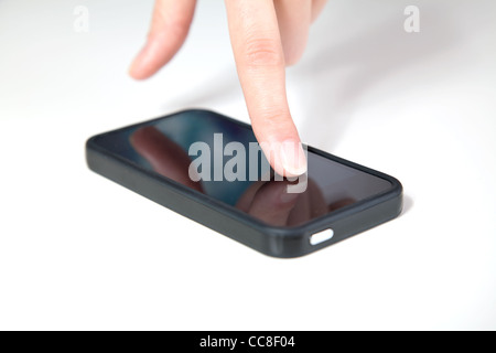 Hand of a woman using a smartphone Stock Photo
