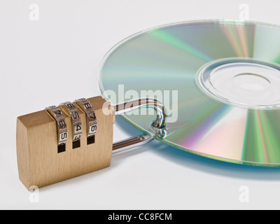 eine CD ist mit einem Zahlenschloss gesichert | a CD is locked with one combination lock Stock Photo