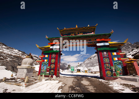 India, Arunachal Pradesh, Sela Pass, high altitude road passing under colourful gateway to Tawang Stock Photo