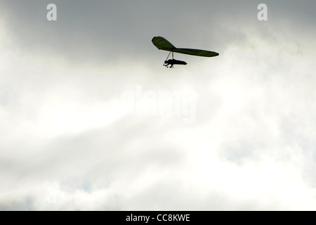 A hang glider uses the winds on the coast of South Devon on a winter morning. Stock Photo