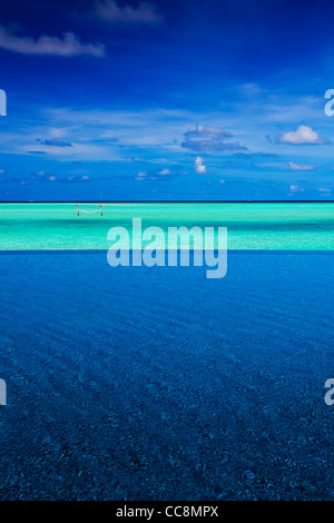 Strip of tropical ocean between intinity pool and sky Stock Photo