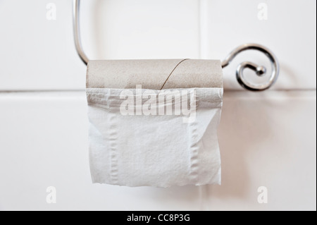 Empty Toilet Roll and Holder Stock Photo