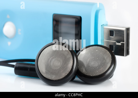 Blue MP3 player with a port USB and black headphones Stock Photo