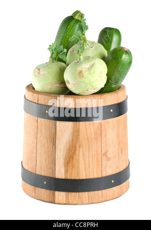 Vegetables in a wooden barrel isolated on white background Stock Photo