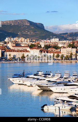 Split cityscape on the Adriatic Sea in Croatia, Dalmatia region, luxury motorboat harbour in the foreground Stock Photo