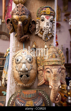 Carved wooden masks of Ganesha, the elephant faced god, Souvenirs for sale, India. Stock Photo
