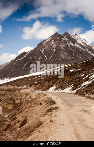India, Arunachal Pradesh, Sela Pass, high altitude road past frozen lake Stock Photo