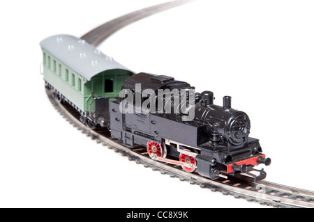 Toy steam train pulling one carriage isolated on white background Stock Photo