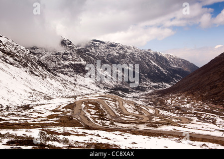 India, Arunachal Pradesh, hairpin bends up steep sloping road past high altitude army camp to Sela Pass Stock Photo