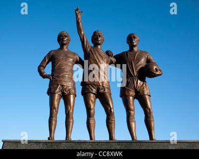 Statues of Sir Bobby Charlton, George Best and Denis Law statue at Old Trafford, Manchester United football ground