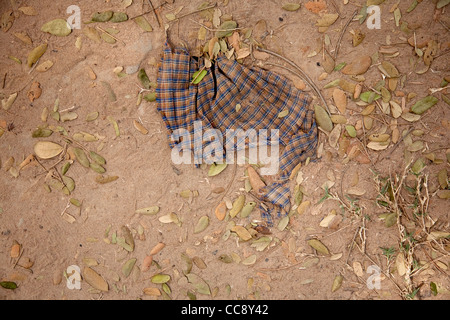 Clothing of still burried victims at the Killing Fields Stock Photo