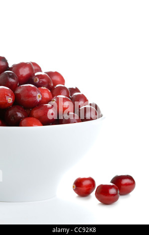 fresh whole cranberries in a white bowl isolated on a white background Stock Photo