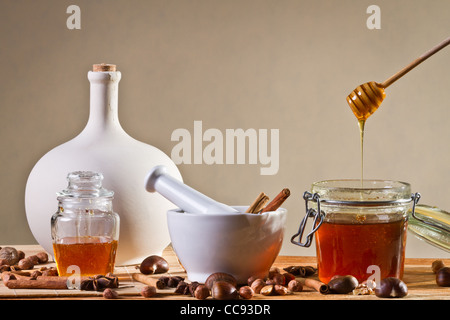 Different kinds of nuts and honey Stock Photo