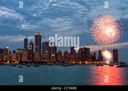 Independence Day fireworks by Chicago skyline over Lake Michigan. Stock Photo