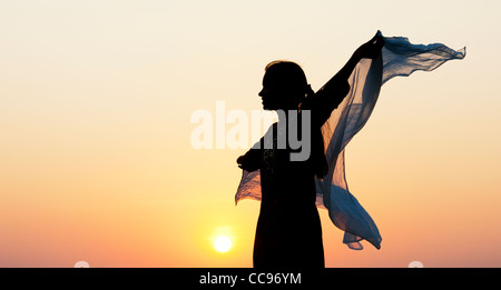 Indian girl with veil in the wind silhouette Stock Photo