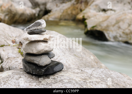 Stones Stacked near Stream, Zauberwald, Berchtesgaden National Park, Bavaria, Germany Stock Photo