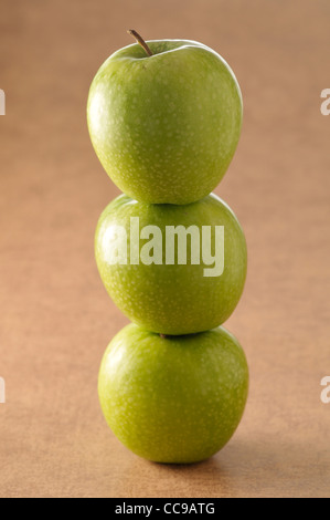 Close-up of Stack of Three, Green Apples Stock Photo
