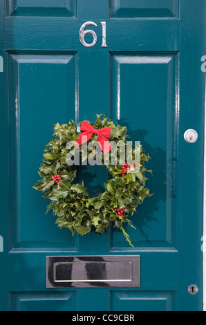 Christmas wreath on front door, UK Stock Photo