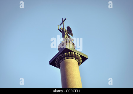 top of famous Alexander Column, showing statue of an angel holding a cross. Monument is placed on Palace Square of St.Petersburg Stock Photo