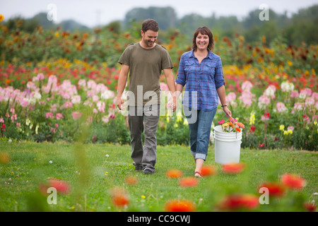 Couple Picking Flowers, Sauvie Island, Oregon, USA Stock Photo