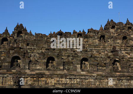 Buddha statue Borobudur Buddhist temple Indonesia Mahayana Barabudur Yogyakarta Central Java Relief UNESCO World Heritage Site Stock Photo