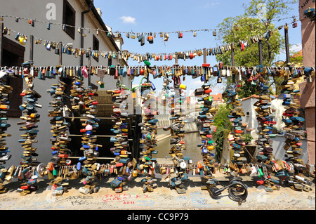 Collection of Love locks on a bridge over a canal in Prague Czech Republic Stock Photo