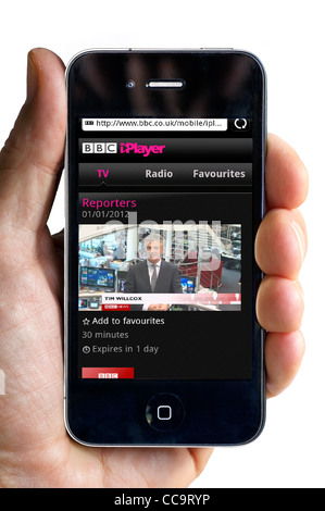 Watching the BBC News Channel on the BBC iPlayer on an Apple iPhone 4 smartphone Stock Photo