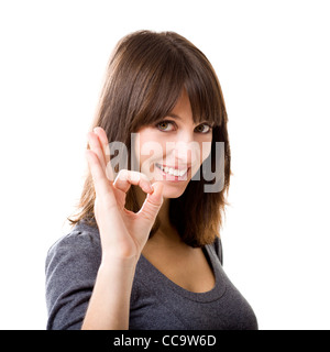 Beautiful woman gesturing an excellent job sign isolated over white background Stock Photo