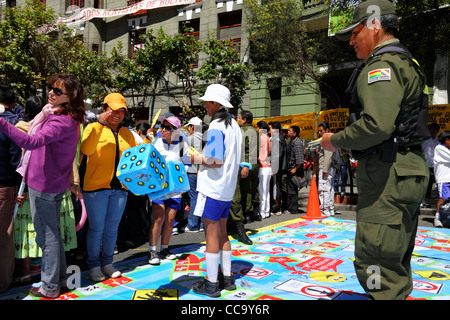 Transport police organise a giant street board game to teach children what road signs mean for Pedestrian Day, La Paz, Bolivia Stock Photo