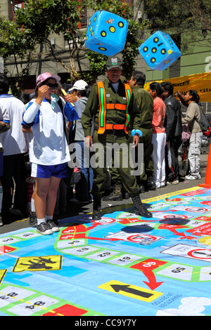 Transport police organise a giant street board game to teach children what road signs mean for Pedestrian Day, La Paz, Bolivia Stock Photo